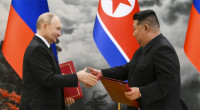 Putin and Kim pledge mutual help against 'aggression'